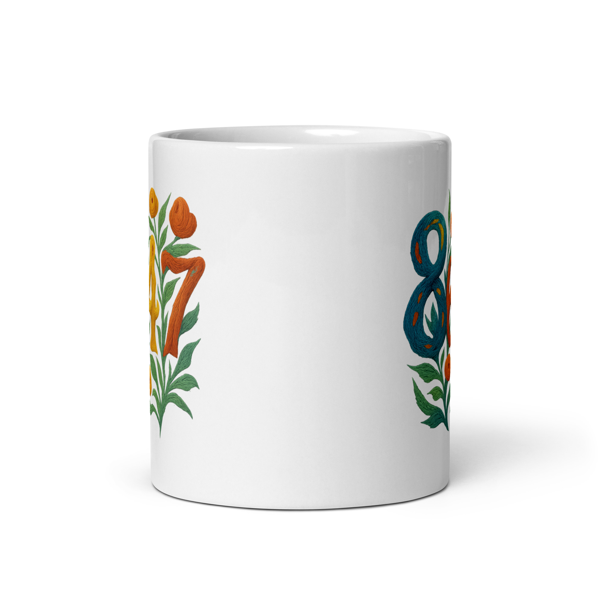 White ceramic mug viewed to see that graphic is on both sides of mug