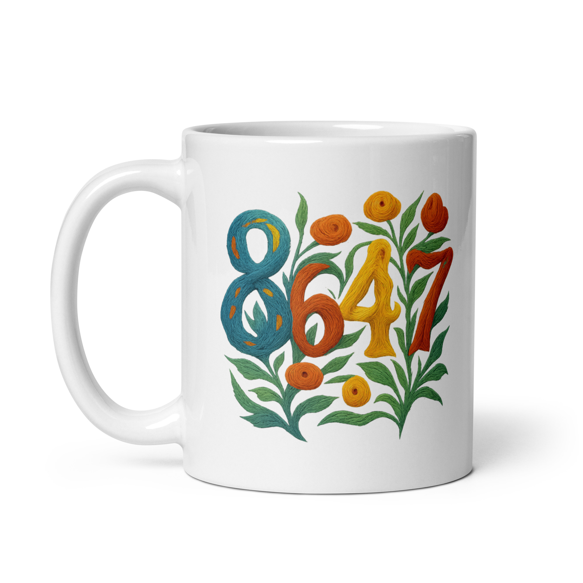 White ceramic mug handle on left with the graphic 8647