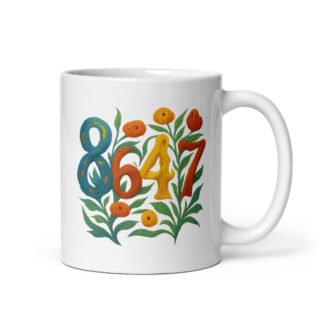 White ceramic mug handle on left with the graphic 8647