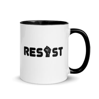White ceramic mug handle on right with the word Resist but the I is a fist graphic